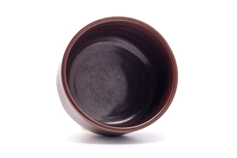 Overhead view into the bowl showing the dark maroon glazed interior.