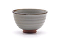 Front view showing the grey glaze and dark brushed motif.