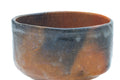 Closer front view of the raku chawan highlighting the flame-fired colour variation.