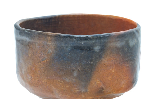 Closer front view of the raku chawan highlighting the flame-fired colour variation.