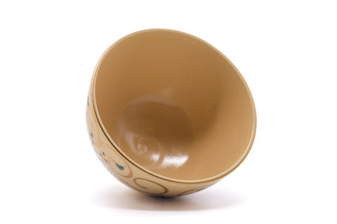 Overhead view into the bowl showing the smooth ochre-glazed interior.