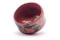 Overhead view into the bowl showing the red glazed interior.