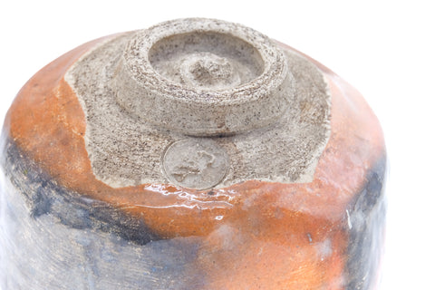 Overhead view of the bowl's underside showing the foot ring and mottled base.