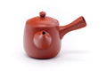 Side view with the handle to the right and spout to the left.