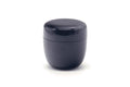 Plain black lacquer natsume tea caddy, front view with lid on showing the glossy jujube shape