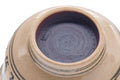 Close-up of the inverted villagers Annan chawan base, showing the foot ring and blue-glazed underside