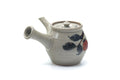Angled overhead view showing the lid, side handle, and spout of the grey kyusu.