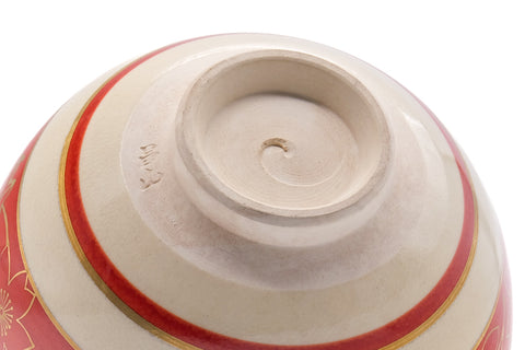 Underside and foot view showing the maker's mark and red banding