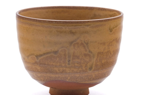 Wider view showing the incised landscape design around the lower body.