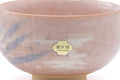 Close-up of the body showing the blue streak accents and a gold maker's seal.
