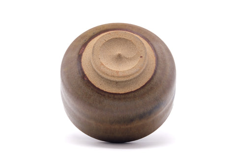 Underside of the chawan showing the foot ring and spiral-turned unglazed base.