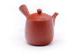 Vermilion Tokoname-yaki side-handle teapot (kyusu) with engraved calligraphy, side handle to the right.