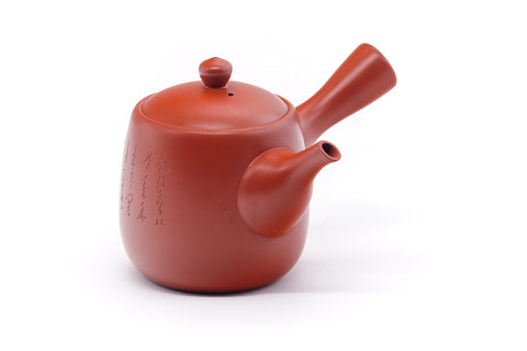 Side view of the red shudei kyusu with the handle to the right.