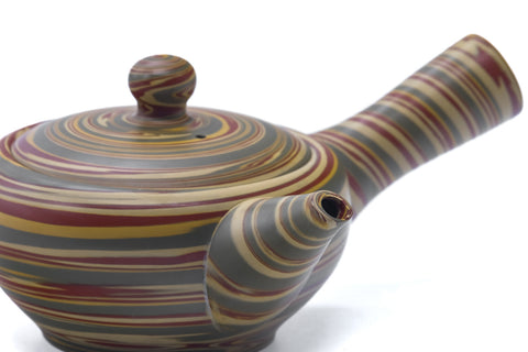 Top-down view of the teapot body showing the swirling layered clay pattern.