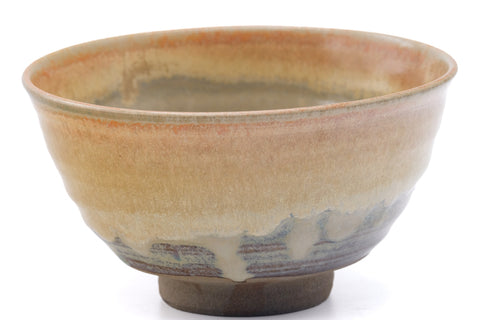 Angled view into the chawan's pale glazed interior well and rim.