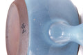 Underside of the kyusu showing the handle attachment and foot.