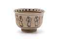 Villagers Annan chawan, front view showing the blue line-drawn figures around the cream body