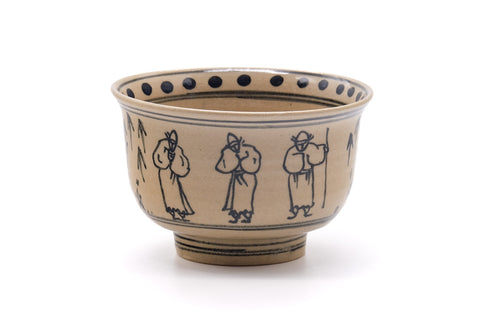 Villagers Annan chawan, front view showing the blue line-drawn figures around the cream body