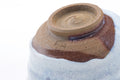 Closeup of the base showing the foot and glaze transition.