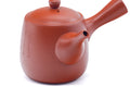 Front view of the vermilion teapot showing the spout.