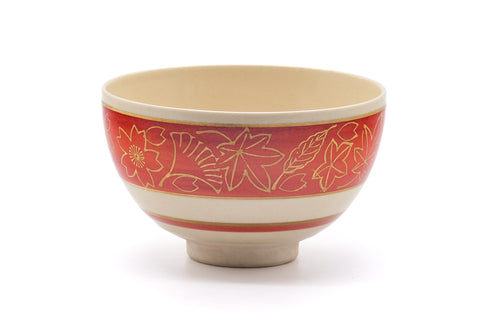 Slightly rotated front view showing the red stripe and gold leaves