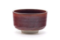 Front view showing the deep maroon glaze with lighter speckles and straight-sided form.