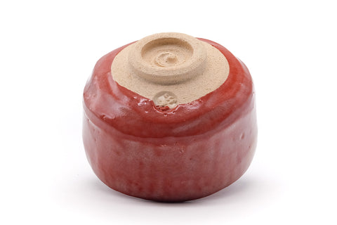 Underside of the chawan showing the spiral-carved pale foot.