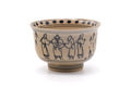 Annan-style (Vietnamese-style) matcha bowl (chawan) painted in blue with figures of villagers and a dotted band at the rim, three-quarter view