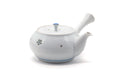 The teapot with the spout to the right and the side handle to the left.