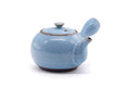 Pale blue glazed Tokoname kyusu, three-quarter view showing the side handle and lid.