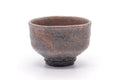 Grey-and-orange Hagi-yaki chawan, front view with a milky white glaze over iron-rich mishima clay.