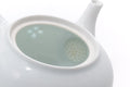 Looking into the teapot, showing the pale glazed interior.