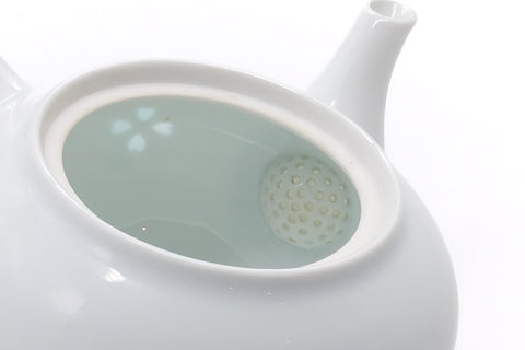 Looking into the teapot, showing the pale glazed interior.