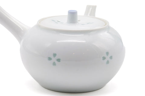Side view of the porcelain kyusu emphasizing the spout and side handle.