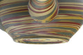 Close-up of the marbled nerikomi stripes in yellow, green, red and brown.