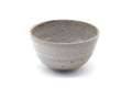 Front view showing the speckled grey glaze and rounded rim.