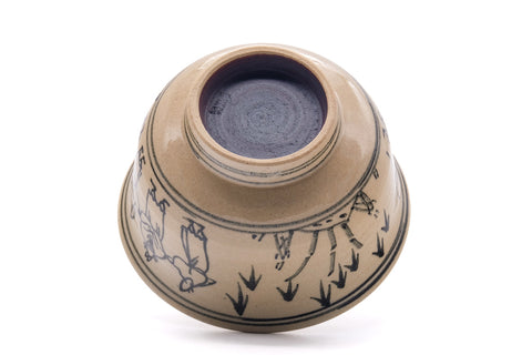 Villagers Annan chawan inverted to show the underside and foot ring with the blue interior visible