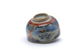 Underside of the teacup tilted to show the foot.