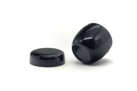 The lid lying flat next to the tilted open caddy body revealing the interior