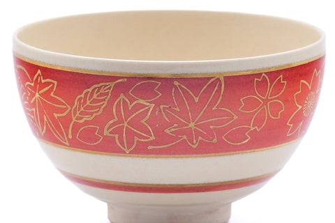 Closeup of the exterior detailing the gold momiji leaves over the red stripe