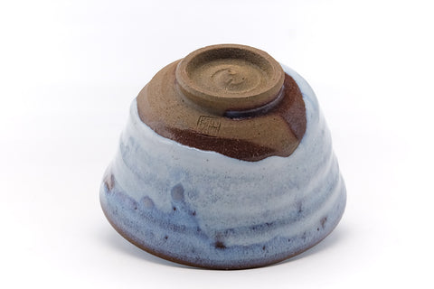 Underside of the chawan showing the brown foot ring and base.