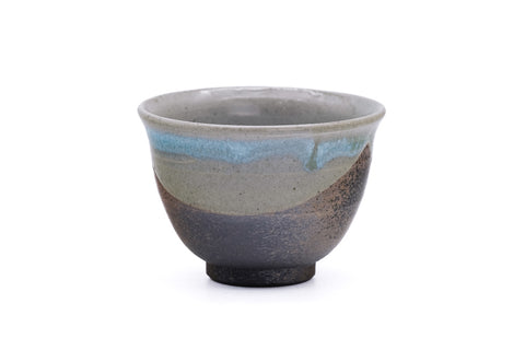 Ceramic teacup with blue ash-glaze