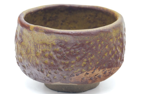 Larger front view of the brown teacup showing the rim and mottled glaze.