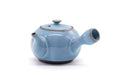 Front view of the blue kyusu with the spout facing forward and lid on.