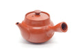 Front view showing the spout and the collared rim and lid.