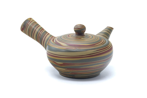 Top view of the teapot showing the side handle, spout and lid.