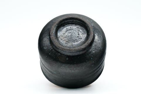 Black ceramic cup on a white background - bottom
