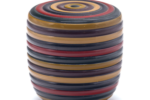 Front view of the closed natsume emphasising the red, gold, and black Koma stripes.