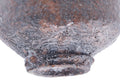 Closeup of the foot and base showing the potter's stamp and finger marks.