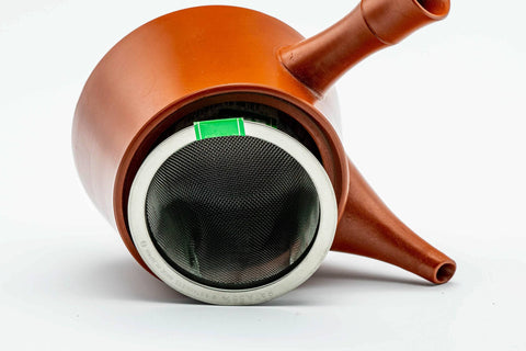 The kyusu with the lid removed, showing the deep built-in mesh basket strainer; the lid rests beside it.